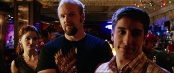 Movie still from “American Wedding” (2003), directed by Jesse Dylan – A man with a beard standing next to a man with short hair; Close Up shot, Over the shoulder angle