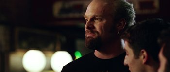 Movie still from “American Wedding” (2003), directed by Jesse Dylan – A person wearing a black shirt; Close Up shot, Over the shoulder angle