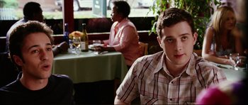 Movie still from “American Wedding” (2003), directed by Jesse Dylan – A man sitting at a table in front of a woman; Close Up shot, Over the shoulder angle