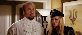 Movie still from “American Wedding” (2003), directed by Jesse Dylan – A man and a woman dressed up in costumes; Close Up shot, Low angle