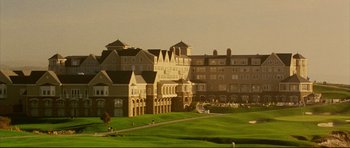 Movie still from “American Wedding” (2003), directed by Jesse Dylan – A view of a large building from across a golf course; Extreme Wide shot, High angle