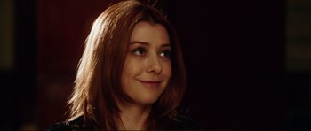 Movie still from “American Wedding” (2003), directed by Jesse Dylan – A person with long brown hair; Close Up shot, Over the shoulder angle