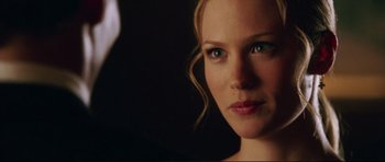 Movie still from “American Wedding” (2003), directed by Jesse Dylan – A woman's face in the dark; Close Up shot, Over the shoulder angle