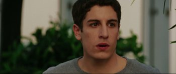 Movie still from “American Wedding” (2003), directed by Jesse Dylan – A person wearing a gray shirt; Close Up shot, Over the shoulder angle