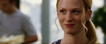 Movie still from “American Wedding” (2003), directed by Jesse Dylan – A woman with blonde hair and blue eyes; Close Up shot, Over the shoulder angle