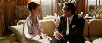 Movie still from “American Wedding” (2003), directed by Jesse Dylan – A man and a woman sitting on a couch talking to each other; Medium shot, Over the shoulder angle