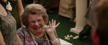 Movie still from “American Wedding” (2003), directed by Jesse Dylan – An older woman wearing a necklace and a ring; Close Up shot, High angle