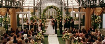 Movie still from “American Wedding” (2003), directed by Jesse Dylan – A couple getting married in a garden setting; Wide shot, High angle