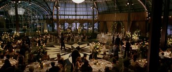 Movie still from “American Wedding” (2003), directed by Jesse Dylan – People are sitting at tables in an indoor setting; Extreme Wide shot, High angle