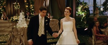 Movie still from “American Wedding” (2003), directed by Jesse Dylan – A man and a woman holding hands while standing next to each other; Medium shot, High angle