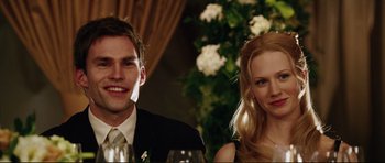 Movie still from “American Wedding” (2003), directed by Jesse Dylan – A man and a woman sitting next to each other at a table; Close Up shot, Low angle