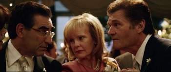 Movie still from “American Wedding” (2003), directed by Jesse Dylan – Two men and a woman standing next to each other; Close Up shot, Over the shoulder angle