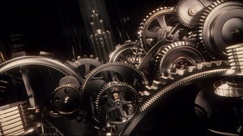 Movie still from “Amores Perros” (2000), directed by Alejandro G. Iñárritu – View of a bunch of metal gears; Extreme Close Up shot, Overhead angle