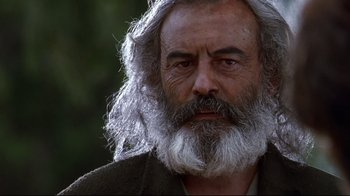 Movie still from “Amores Perros” (2000), directed by Alejandro G. Iñárritu – An old man with a long white beard; Close Up shot, Low angle
