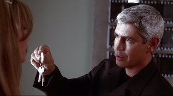 Movie still from “Amores Perros” (2000), directed by Alejandro G. Iñárritu – A man holding a pair of keys in his hand; Close Up shot, Over the shoulder angle
