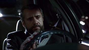 Movie still from “Amores Perros” (2000), directed by Alejandro G. Iñárritu – A man sitting in a car holding a steering wheel; Close Up shot, Low angle
