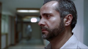 Movie still from “Amores Perros” (2000), directed by Alejandro G. Iñárritu – A person with a beard; Close Up shot, Low angle
