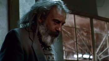 Movie still from “Amores Perros” (2000), directed by Alejandro G. Iñárritu – An older man with long hair and a beard; Close Up shot, Low angle