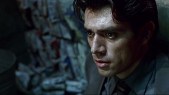 Movie still from “Amores Perros” (2000), directed by Alejandro G. Iñárritu – A person wearing a suit and tie; Close Up shot, Low angle