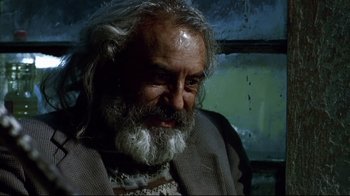 Movie still from “Amores Perros” (2000), directed by Alejandro G. Iñárritu – An old man with a beard and a white beard; Close Up shot, Low angle