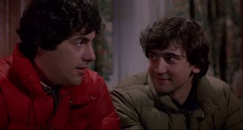 Movie still from “An American Werewolf in London” (1981), directed by John Landis – Two young men sitting next to each other in a room; Close Up shot, Over the shoulder angle