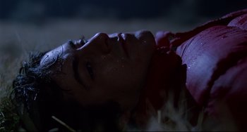 Movie still from “An American Werewolf in London” (1981), directed by John Landis – A man laying on the ground in the dark; Close Up shot, Low angle