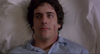 Movie still from “An American Werewolf in London” (1981), directed by John Landis – A person laying in a bed; Close Up shot, High angle
