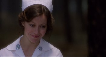 Movie still from “An American Werewolf in London” (1981), directed by John Landis – A woman wearing a white nurse's uniform; Close Up shot, Over the shoulder angle