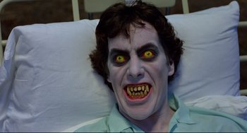 Movie still from “An American Werewolf in London” (1981), directed by John Landis – A person wearing a vampire costume; Close Up shot, Overhead angle