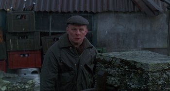 Movie still from “An American Werewolf in London” (1981), directed by John Landis – A man wearing a hat and a jacket; Medium shot, Over the shoulder angle