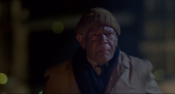Movie still from “An American Werewolf in London” (1981), directed by John Landis – An older man wearing a hat and a coat; Close Up shot, Low angle