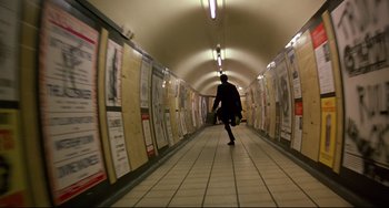 Movie still from “An American Werewolf in London” (1981), directed by John Landis – A person walking down a long hallway in a subway station; Extreme Wide shot, High angle