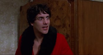 Movie still from “An American Werewolf in London” (1981), directed by John Landis – A man in a red jacket looking up at the sky; Close Up shot, Low angle