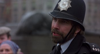 Movie still from “An American Werewolf in London” (1981), directed by John Landis – A person wearing a police uniform; Close Up shot, Over the shoulder angle