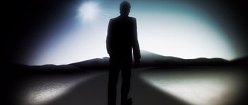 Movie still from “An Education” (2009), directed by Lone Scherfig – A man in a suit standing in the middle of the desert; Wide shot, Low angle