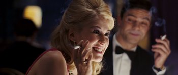 Movie still from “An Education” (2009), directed by Lone Scherfig – A beautiful blond woman talking on a cell phone; Close Up shot, Over the shoulder angle