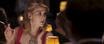Movie still from “An Education” (2009), directed by Lone Scherfig – A beautiful woman sitting in front of a table; Close Up shot, Over the shoulder angle