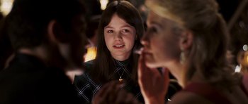 Movie still from “An Education” (2009), directed by Lone Scherfig – A girl is looking at a woman in a black and white plaid shirt; Close Up shot, Over the shoulder angle