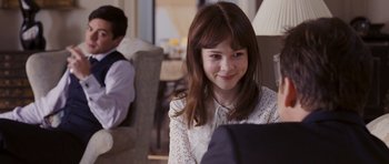 Movie still from “An Education” (2009), directed by Lone Scherfig – A young girl sitting in front of a laptop computer; Close Up shot, Over the shoulder angle