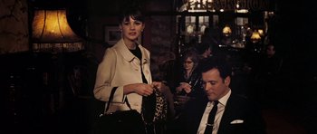 Movie still from “An Education” (2009), directed by Lone Scherfig – A man and a woman in a restaurant; Medium shot, Over the shoulder angle