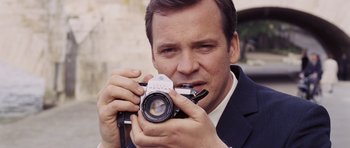 Movie still from “An Education” (2009), directed by Lone Scherfig – A person taking a picture with a camera; Close Up shot, High angle