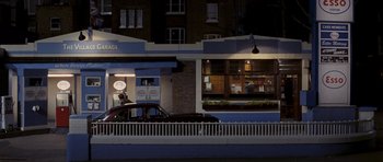Movie still from “An Education” (2009), directed by Lone Scherfig – A car parked in front of a building at night; Extreme Wide shot, High angle