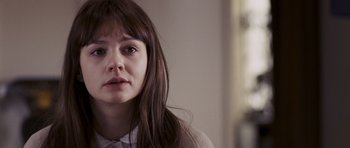 Movie still from “An Education” (2009), directed by Lone Scherfig – A person with long brown hair; Close Up shot, Over the shoulder angle