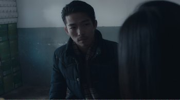 Movie still from “An Elephant Sitting Still” (2018), directed by Bo Hu – A man and a woman are looking at one another; Close Up shot, Over the shoulder angle
