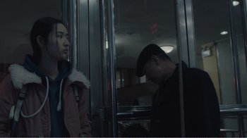 Movie still from “An Elephant Sitting Still” (2018), directed by Bo Hu – A man and a woman on a train; Medium shot, Over the shoulder angle