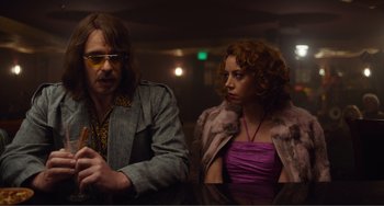 Movie still from “An Evening with Beverly Luff Linn” (2018), directed by Jim Hosking – A man and a woman are standing next to each other; Medium shot, Over the shoulder angle