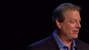 Movie still from “An Inconvenient Truth” (2006), directed by Davis Guggenheim – A person wearing a suit and tie; Close Up shot, Low angle