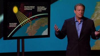 Movie still from “An Inconvenient Truth” (2006), directed by Davis Guggenheim – A man standing in front of a large screen; Medium shot, Over the shoulder angle