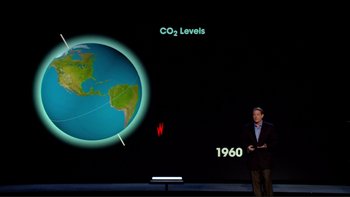 Movie still from “An Inconvenient Truth” (2006), directed by Davis Guggenheim – A man standing in front of a projection of a globe; Wide shot, Overhead angle