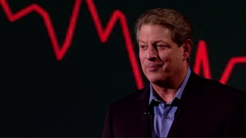 Movie still from “An Inconvenient Truth” (2006), directed by Davis Guggenheim – A man standing in front of a wall with a graph in the background; Medium shot, Low angle